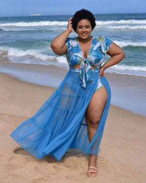 Blue tropical leaf swim set with tie-front top, matching bottoms and sheer tiered maxi skirt