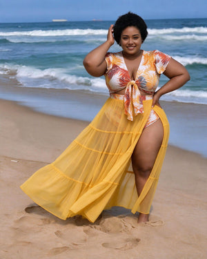Mustard tropical leaf swim set with tie-front top, matching bottoms and sheer tiered maxi skirt