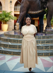 Beige pleated maxi dress with gathered stretch waist and short sleeves
