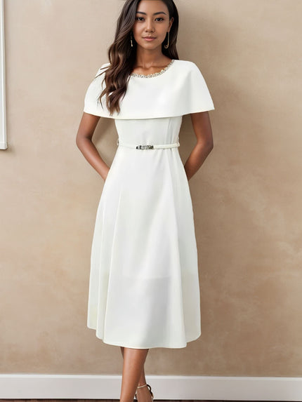 White midi dress with chain neckline, short sleeves, and waist belt