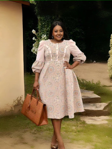 Pink floral midi dress with puff sleeves and pleated waist, fitted bodice