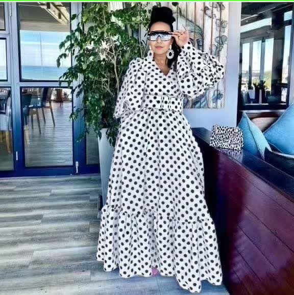 Plus size polka dot maxi dress, white with black spots, puff sleeves and tiered skirt
