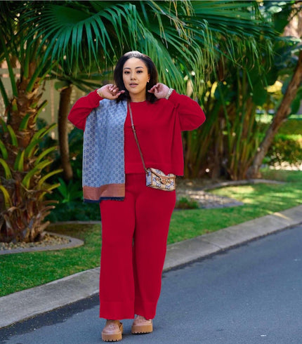 Red knit two-piece set with wide-leg loose pants and zip-front top