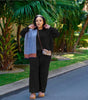 Black knit two-piece set with wide-leg loose pants and zip-front top