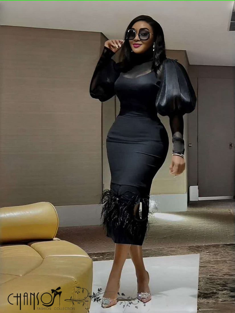 Black midi evening dress with puff sleeves and feather-trimmed hem