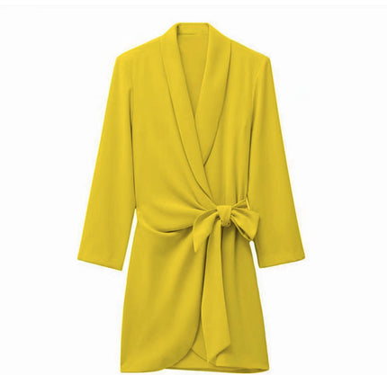 Yellow wrap mini dress with long sleeves, V-neck, and waist tie bow detail.