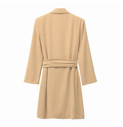 Tan wrap mini dress with long sleeves, V-neck, and belt tie at the waist.
