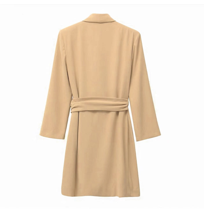 Tan wrap mini dress with long sleeves, V-neck, and belt tie at the waist.