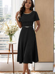 Black midi dress with chain neckline, short sleeves, and waist belt