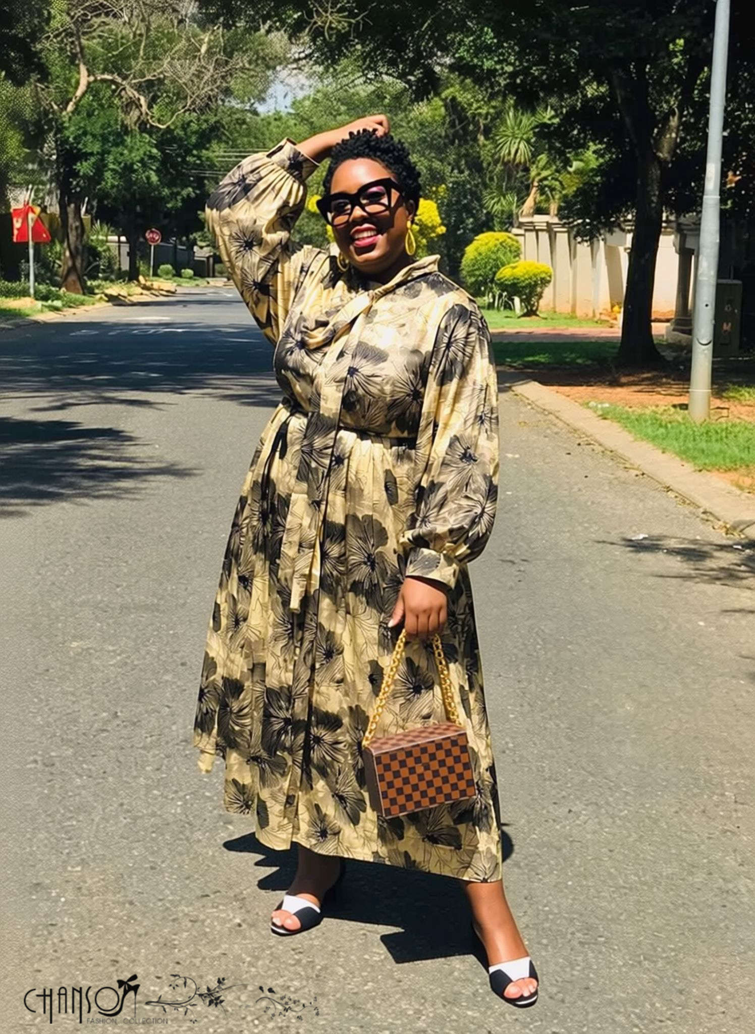 Plus size tie neck long sleeve floral print midi dress on model outdoors