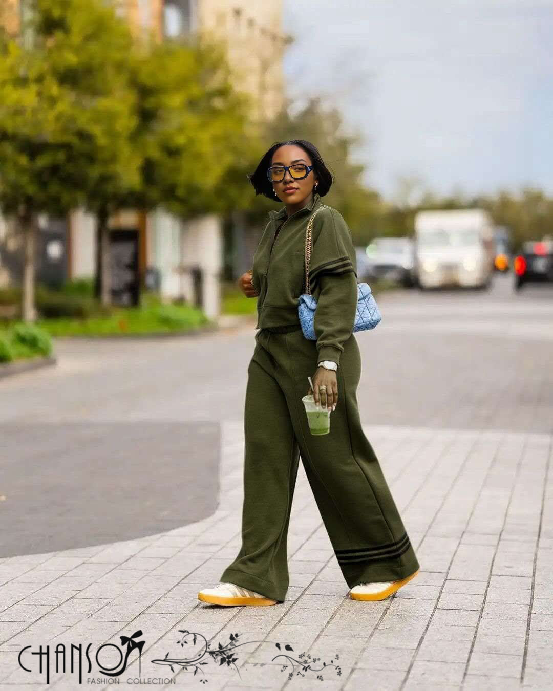 Army green zip-up jacket and wide-leg stripe pants with contrast cuff/hem stripes
