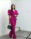 Magenta puff-sleeve peplum-style top with matching wide-leg trousers twin set