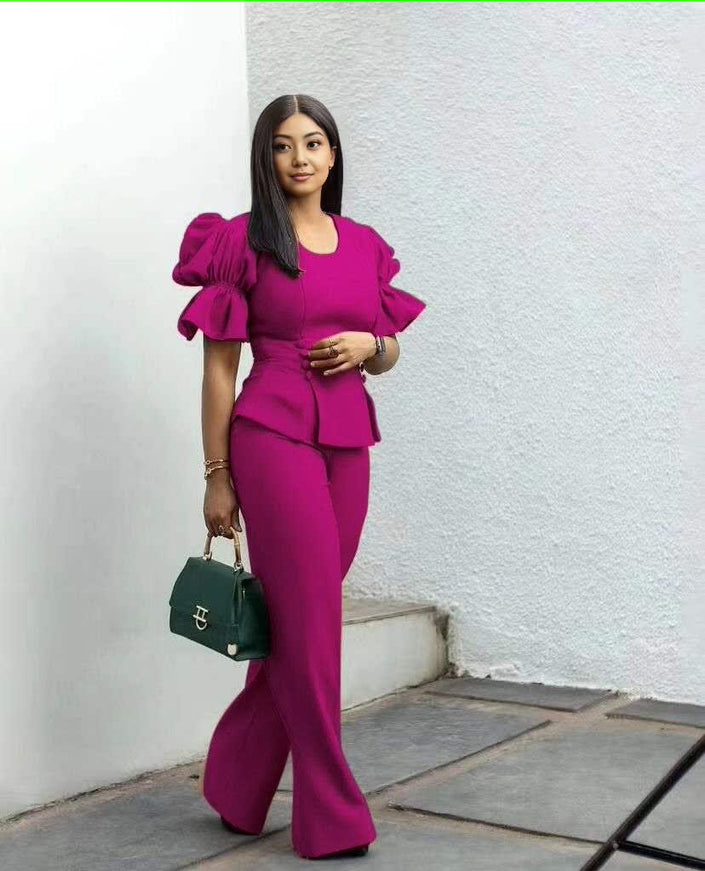 Magenta puff-sleeve peplum-style top with matching wide-leg trousers twin set
