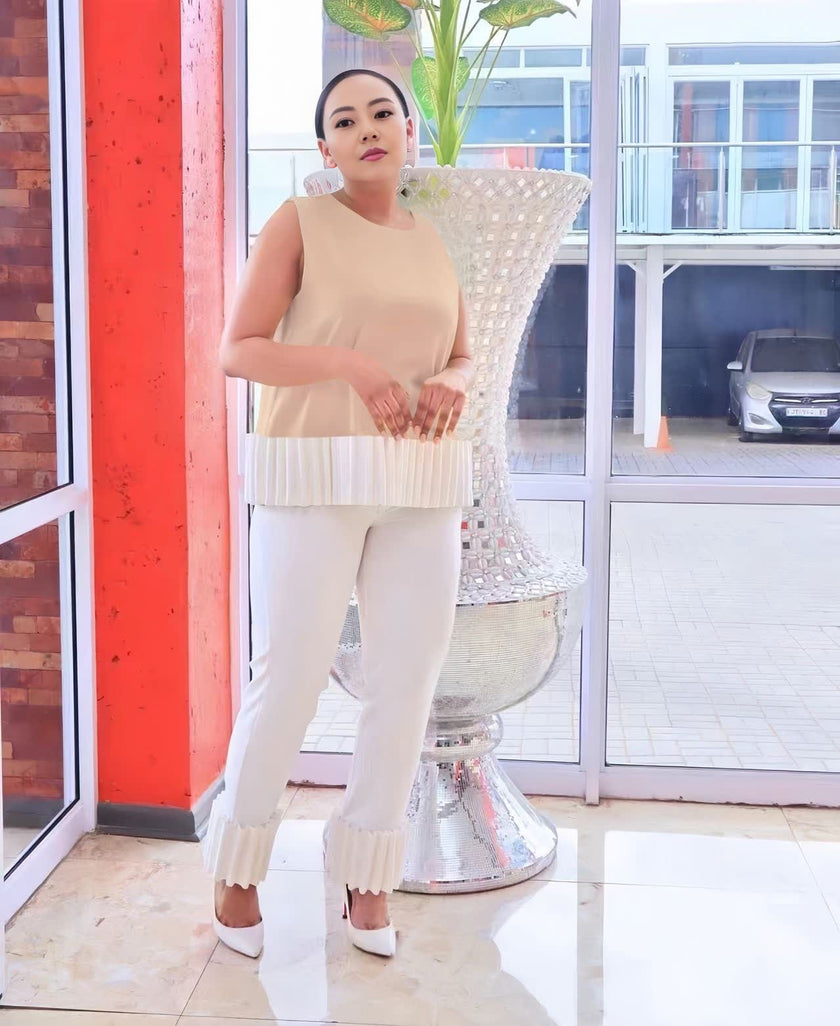 Cream straight-leg pants with fringed bottom hem