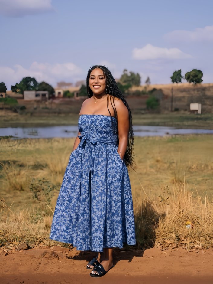 Blue floral midi dress with thin straps and waist tie