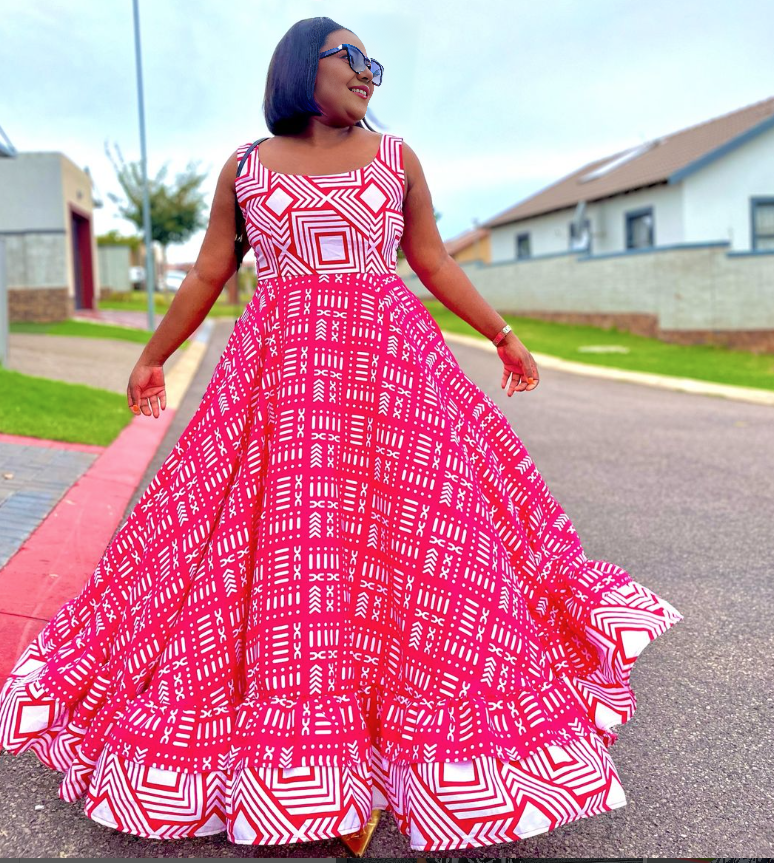 Red and white geometric maxi dress with square neckline and flared skirt