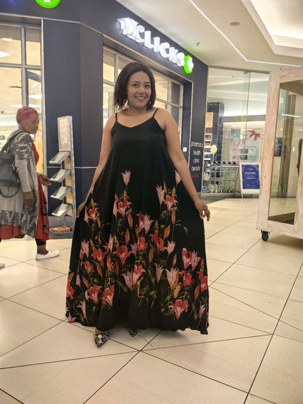 Black sleeveless maxi dress with red floral flared skirt
