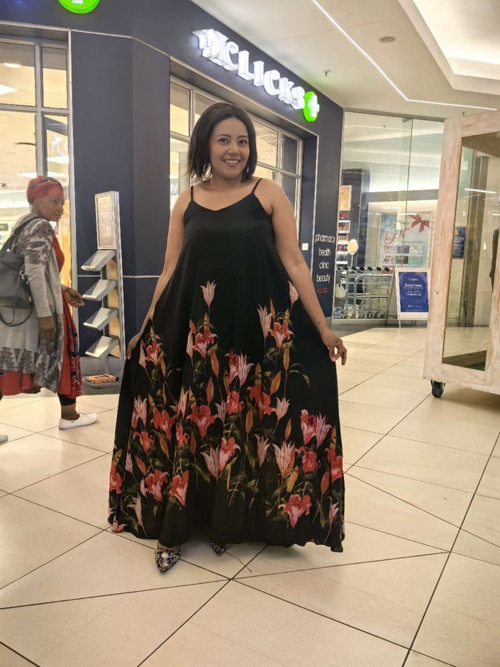 Black sleeveless maxi dress with red floral flared skirt