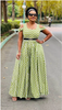 Yellow-green wide-leg jumpsuit with geometric pattern, fitted waist and puff sleeves