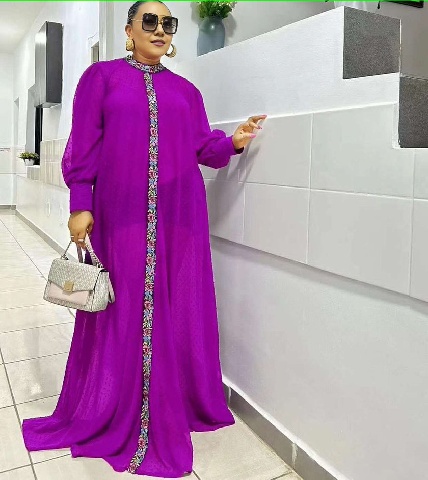 Purple maxi dress with long sleeves and floral placket trim