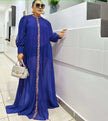 Blue maxi dress with long sleeves and floral placket trim
