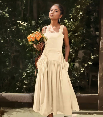 Sleeveless midi dress in pale cream, square neckline, gathered waist and tiered skirt