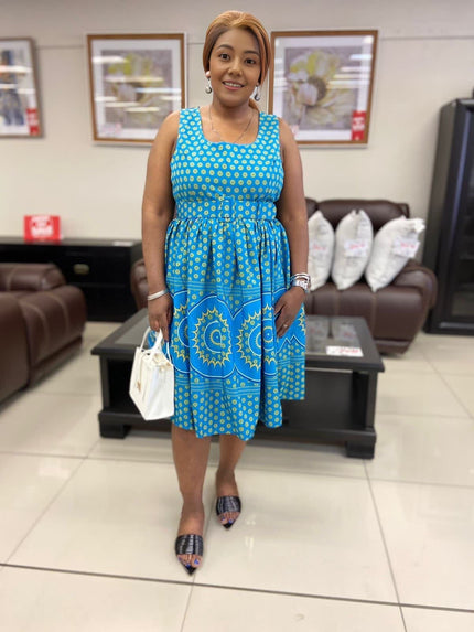 Blue midi dress with patterned hem and gathered skirt, square neckline