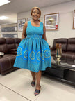 Blue midi dress with geometric print, square neckline, full gathered skirt