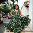 Dark green floral maxi dress with bow tie shoulder straps and gathered A-line skirt