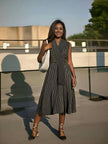 Black striped A-line midi dress with cross-neck and short sleeves