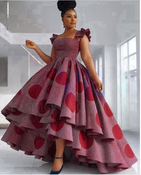 Layered ruffle maxi dress in maroon with large red polka dots and tiered skirt