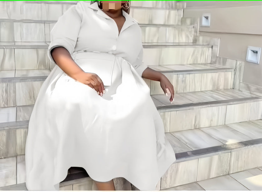 White belted midi dress with pointed collar, button front, and three-quarter sleeves