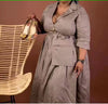 knee-length dress with a collar, waist belt, button details, and pockets