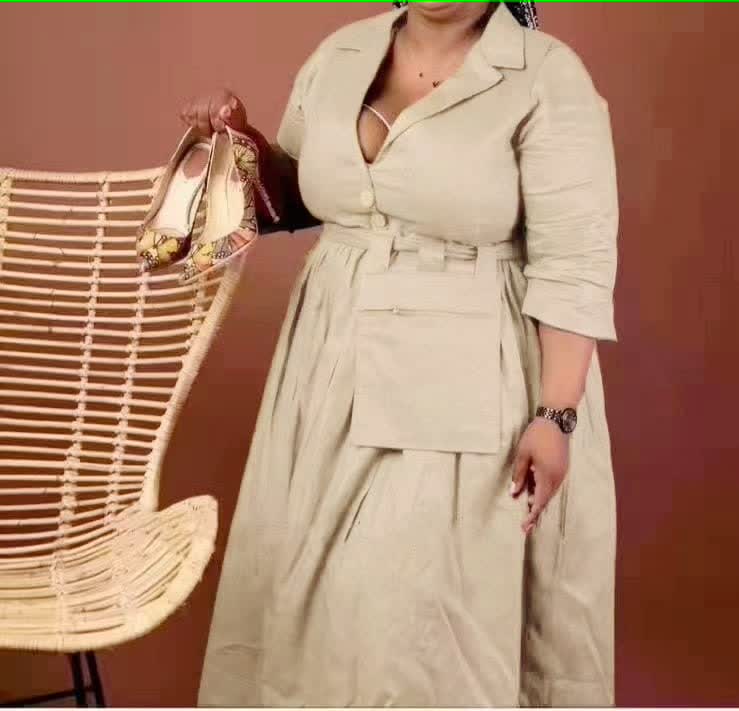 Cream belted midi dress with pointed collar, button front, and three-quarter sleeves
