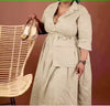 knee-length dress with a collar, waist belt, button details, and pockets