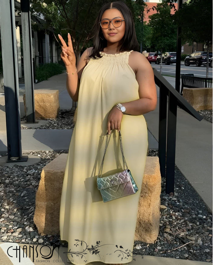 Beige sleeveless maxi dress with gathered high neckline and flowing skirt