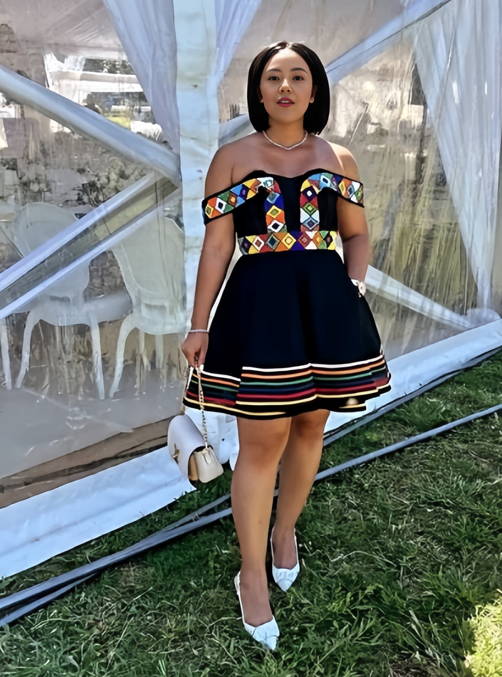 Off-shoulder mini dress with geometric print bodice and navy striped hem skirt