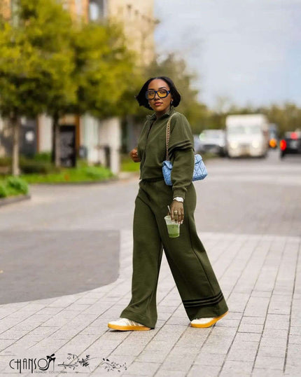 Dark green zip-front jacket with striped cuffs and wide-leg pants, matching set