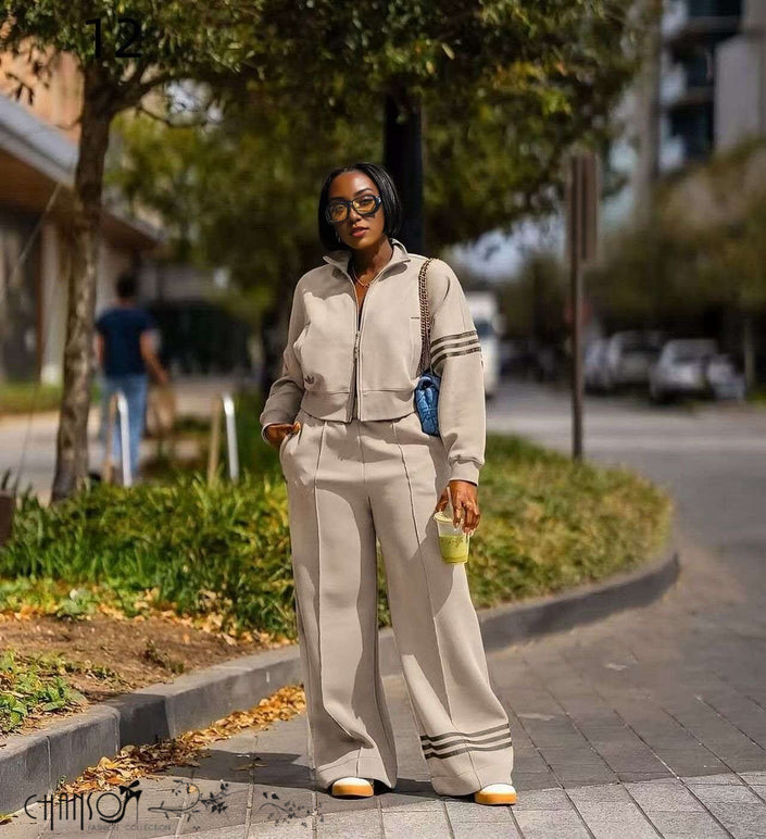 Nude zip-front jacket with striped cuffs and wide-leg pants, matching set