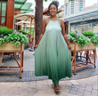 Pleated maxi dress with spaghetti straps, mint-green flowy A-line skirt and gathered bodice.