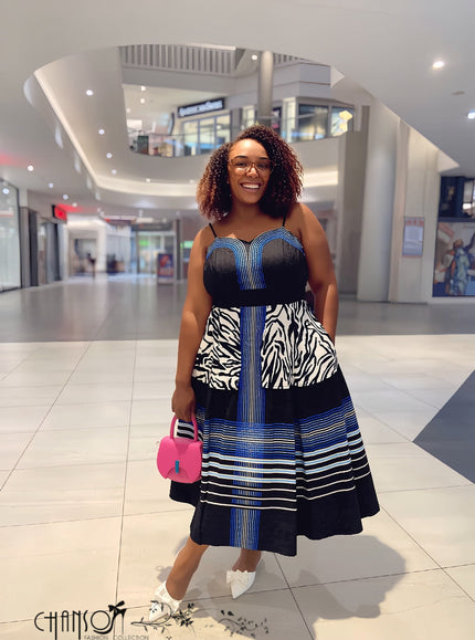 Spaghetti strap midi dress with mixed animal stripe print, navy bodice and striped skirt