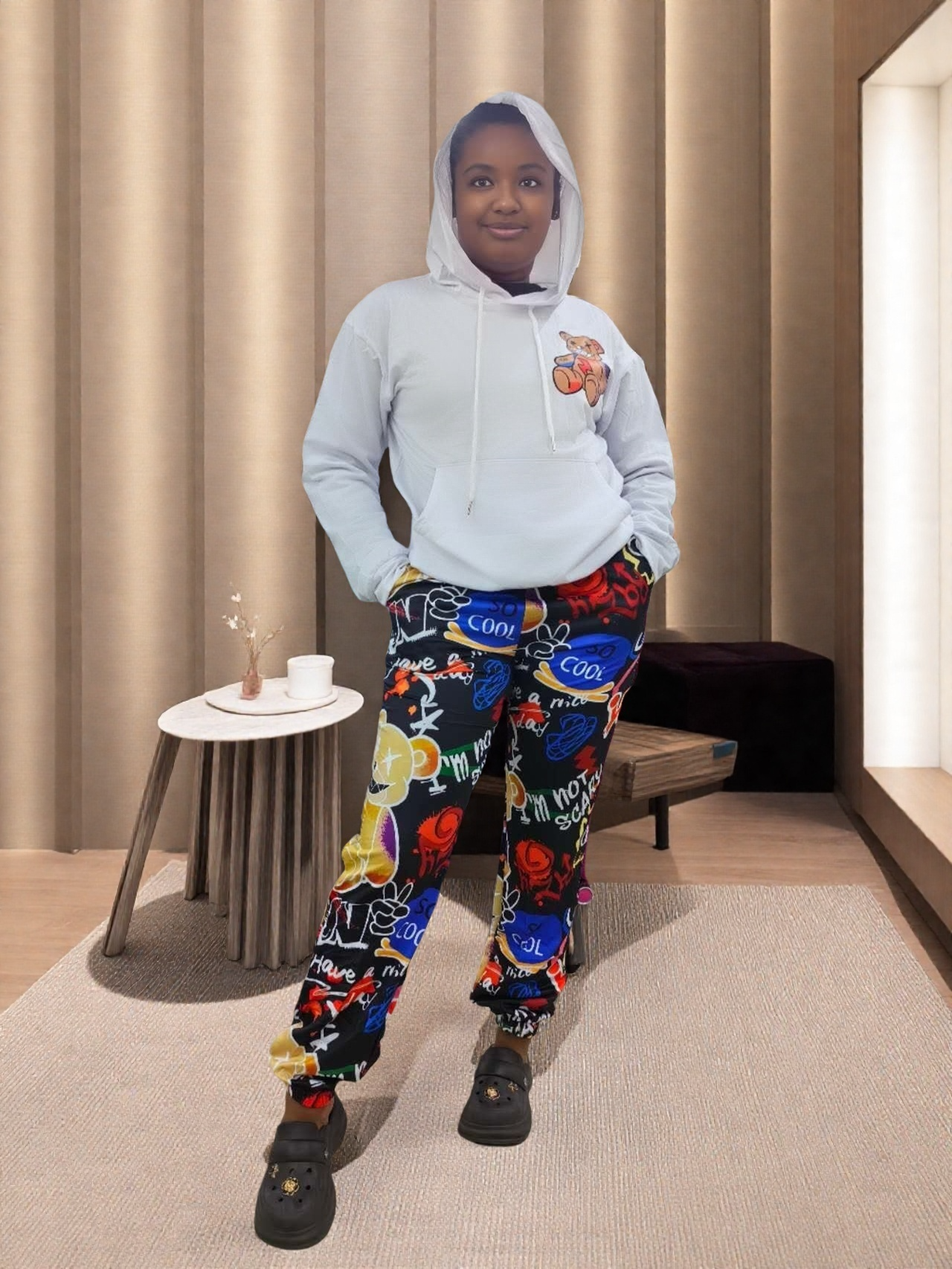 Kids hoodie and pants set with cartoon chest patch; matching dark printed joggers