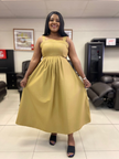 Mustard yellow pleated sleeveless midi dress with high waist seam and full skirt