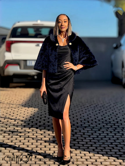 Black faux fur cropped cape jacket with brooch accent at neckline