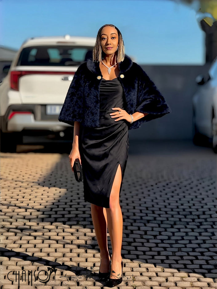 Black faux fur cropped cape jacket with brooch accent at neckline