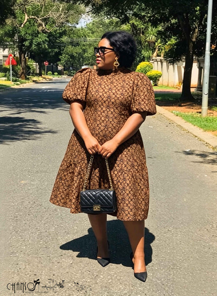 Brown lace mini dress with short puff sleeves and flared hem