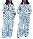 Snake-print twin set: cropped button shirt and high-waist wide-leg pants, light blue