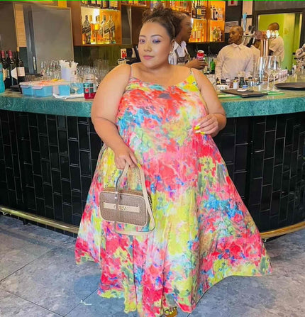 Sleeveless maxi dress with colorful splash print, scoop neckline and gathered skirt
