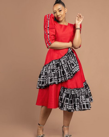 Tiered midi dress with puff sleeves, red bodice and black patterned tiered skirt