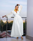 White puff-sleeve maxi evening dress with V-neck bodice and front slit